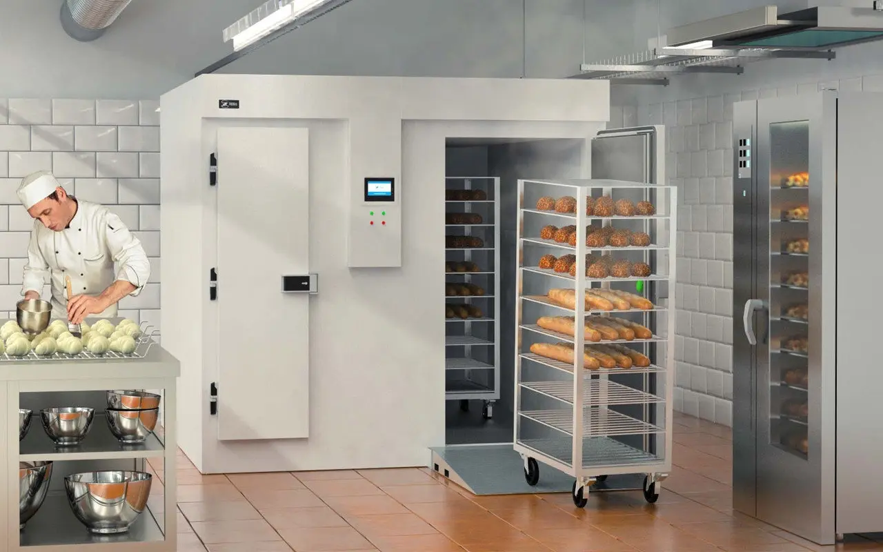 Professional restaurant cold room with open door showcasing shelves stocked with fresh vegetables and fruits